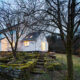 White cottage at night in dart more featuring old Dartmoor walls